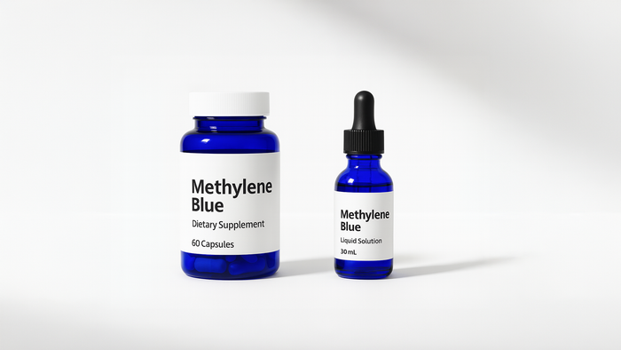Generic methylene blue capsules and liquid supplement in blue glass bottles no branding minimal design pharmaceutical style dropper bottle and capsule bottle dietary supplement