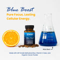 Blue Boost supplement bottle with an orange, coffee beans, and a beaker of blue liquid on a white background.