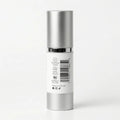 Silver skincare bottle with a white label on a light gray background